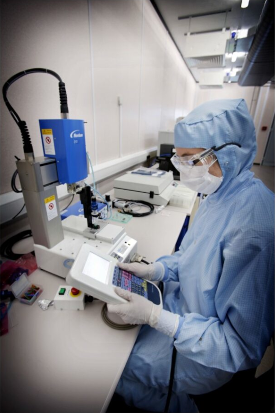 Research student working in a SMC Clean room, University of Edinburgh